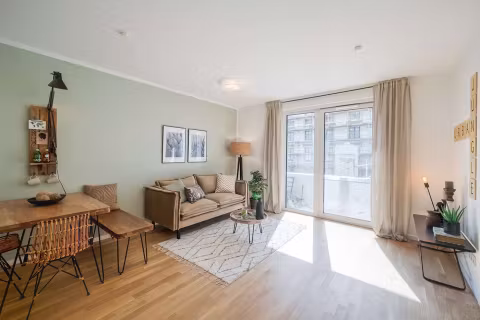 79080-1441224-vnfnCR8jSTU7yGBQmaviYpoj-03_Wohnbereich-Musterwohnung